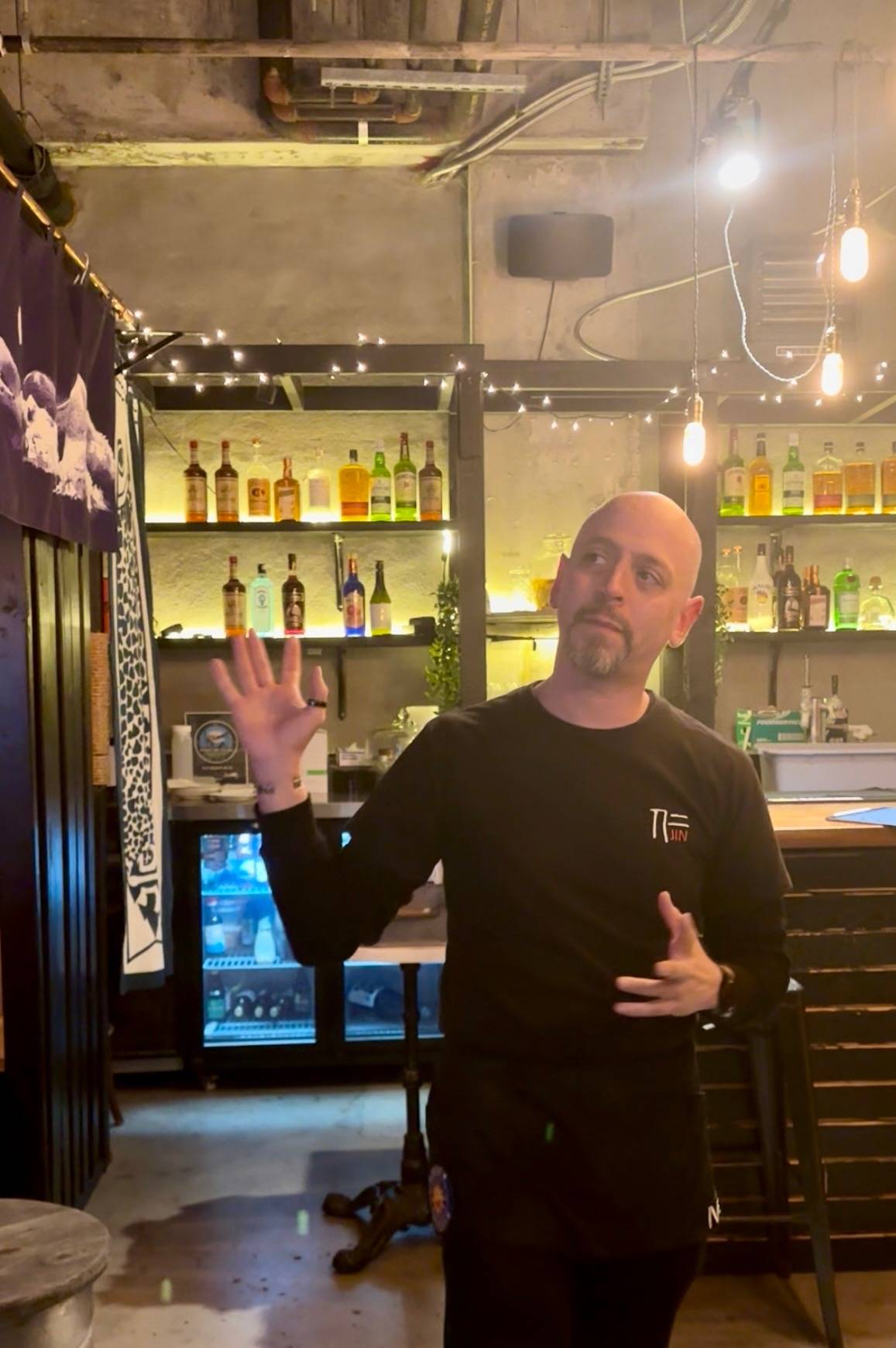 Carlos speaking at Jin Ramen during the meetup