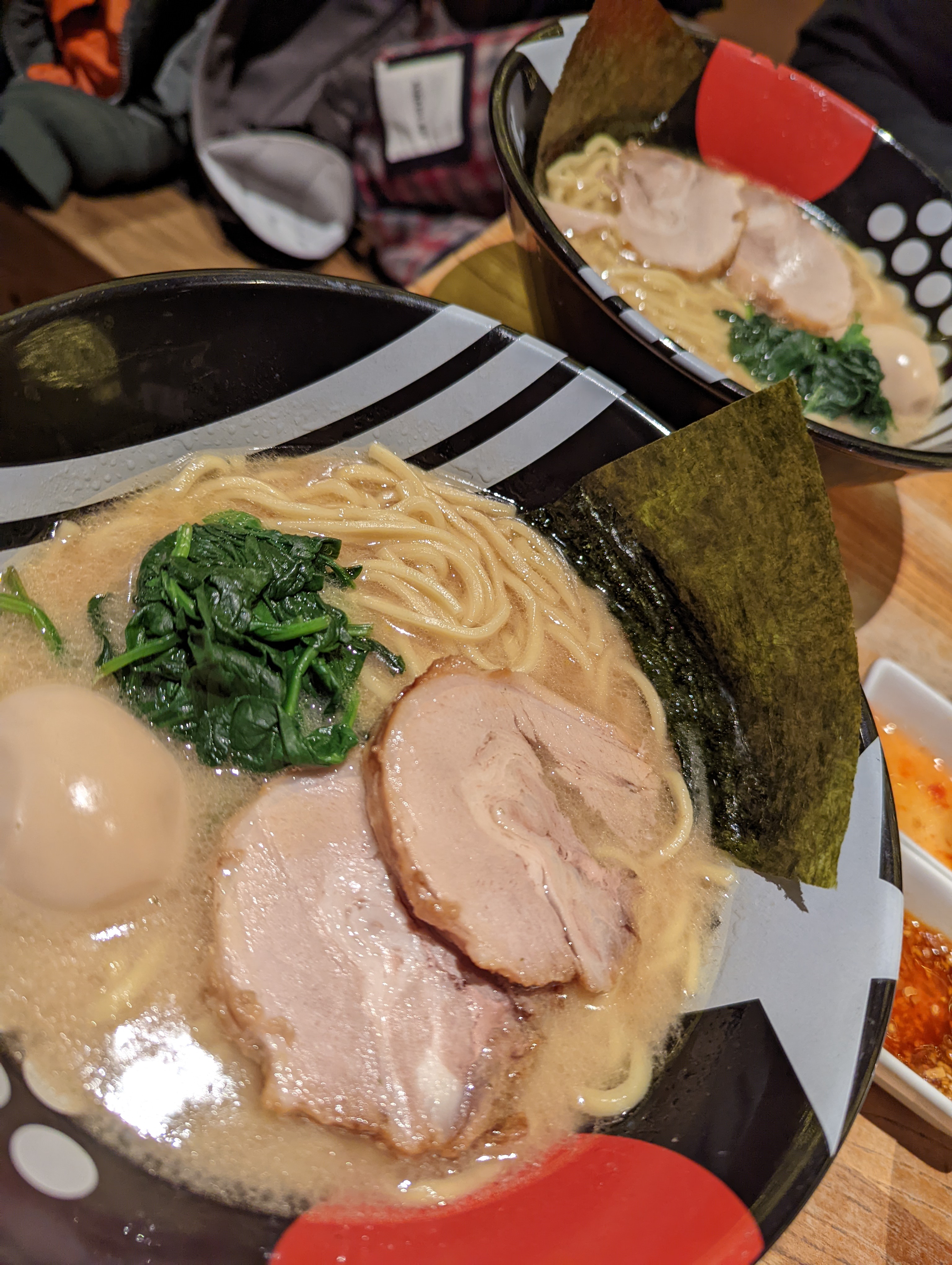 E.A.K. Ramen iekei-style bowl — creamy shoyu-tonkotsu broth with spinach and chashu